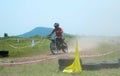 Motocross bike racer/rider on track in India.