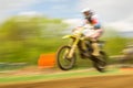 Biker on motocross in motion Royalty Free Stock Photo