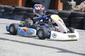 kid driving competition kart on training