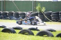 Kid driving competition kart on training