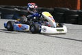 Kid driving competition kart on training