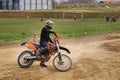 Motocross competition. Motorcyclist making brake turn. Royalty Free Stock Photo