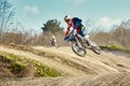 Motocross concept, a biker goes off-road making extreme skiing. In pursuit of adrinalin, sport concept. Dangerous sport. Royalty Free Stock Photo