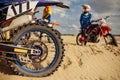 Motocross driver on extreme desert terrain track