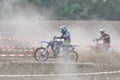 Motocross drivers in dust