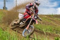 Motocross. Motorcyclist rushes along a dirt road, dirt flies from under the wheels.