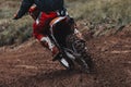 Motocross, pieces of dirt flying off the bike, off-road motorbike races, rear view Royalty Free Stock Photo