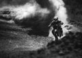 Motocross racer accelerating in dust track, Black and white photo Royalty Free Stock Photo