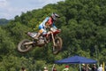 Motocross racer airborne at national competition Royalty Free Stock Photo