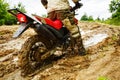 The man on a motorcycle rides through the mud Royalty Free Stock Photo