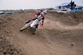 Motocross racer veering with large slope Royalty Free Stock Photo