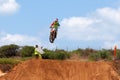 Motocross rider and bike clearing a tabletop jump Royalty Free Stock Photo