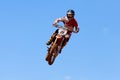 Motocross rider and bike clearing a tabletop jump Royalty Free Stock Photo