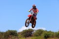 Motocross rider and bike clearing a tabletop jump Royalty Free Stock Photo