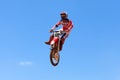 Motocross rider and bike clearing a tabletop jump Royalty Free Stock Photo