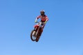 Motocross rider and bike clearing a tabletop jump Royalty Free Stock Photo