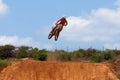 Motocross rider and bike clearing a tabletop jump Royalty Free Stock Photo