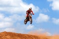 Motocross rider and bike clearing a tabletop jump Royalty Free Stock Photo