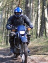 Motocross rider in dirt path