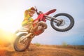 Motocross rider doing a wheelie Royalty Free Stock Photo