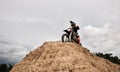 Motocross rider on his bike ready to race in dirt track Royalty Free Stock Photo