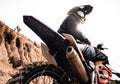 Motocross rider on his bike ready to race in dirt track Royalty Free Stock Photo