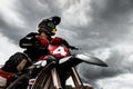 Motocross rider on his bike ready to race in dirt track Royalty Free Stock Photo