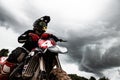 Motocross rider on his bike ready to race in dirt track Royalty Free Stock Photo