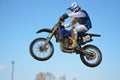 Motocross rider jump, blue sky Royalty Free Stock Photo
