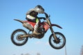 Motocross rider jump, blue sky Royalty Free Stock Photo