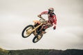 Motocross rider jumping with his motorcycle