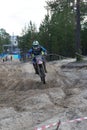 Motocross rider on a motorcycle on the race track in the city of Noyabrsk, Yamalo-Nenets Autonomous District Royalty Free Stock Photo