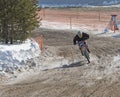 Motocross rider on a motorcycle on the race track in the city of Noyabrsk, Yamalo-Nenets Autonomous District Royalty Free Stock Photo