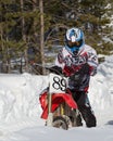 Motocross rider on a motorcycle on the race track in winter in the city of Noyabrsk, Yamalo-Nenets Autonomous District Royalty Free Stock Photo