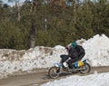 Motocross rider on a motorcycle on the race track in winter in the city of Noyabrsk, Yamalo-Nenets Autonomous District Royalty Free Stock Photo