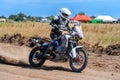A Motocross rider riding on extreme dust track Royalty Free Stock Photo