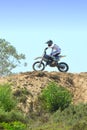 Motocross rider on top of hill Royalty Free Stock Photo