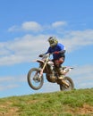 Motocross: the rider on top of a hill Royalty Free Stock Photo