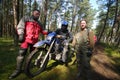 Motocross riders in forest Royalty Free Stock Photo