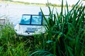 Motor boat, a boat in the reeds at the pier