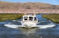 A motor boat on the Lake Titicaca, Peru