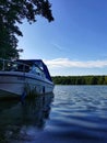 Motor boat moored at the pier, Jasiowy Zak?tek Mi?om?yn facility.