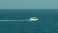 Motor boat moving from harbor to Gulf near the Sharq Marina morning timelapse after sunrise in Kuwait. Kuwait City