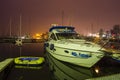 Motor boat and pontoon moored to the jetty