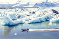 Motor boat sailing on the azure waters between the icebergs Royalty Free Stock Photo