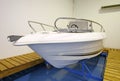 Motor boat in showroom or garage Royalty Free Stock Photo