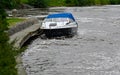 Motor boat tied to wooden jetty in stream Orebro Sweden august 9 2023