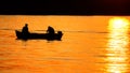 Motor boat with two passengers moving on a quiet autumn sea