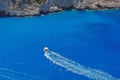 Blue water background. Motor boating on azure water, Ionian Sea - Zakynthos Island, landmark attraction in Greece. Seascape Royalty Free Stock Photo