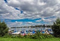 Motor-Boats aligned on beach water, with pleasing landscape and cloudy sunny sky in Tanjung Benoa, Bali, Indonesia.